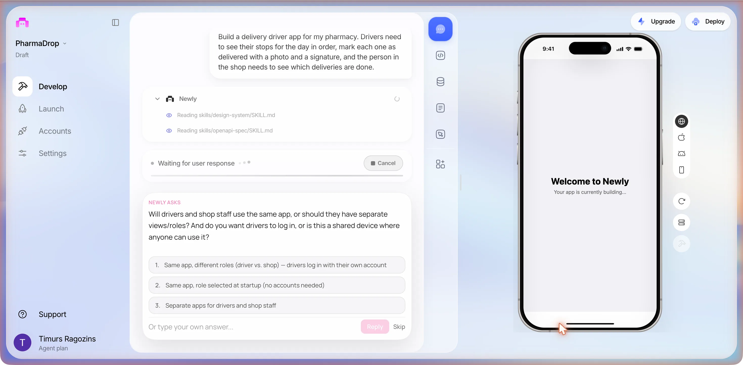 The editor with the brief quoted at the top of the chat, two Reading skills rows, a status row reading Waiting for user response, and a NEWLY ASKS card asking whether drivers and shop staff use the same app or separate roles and whether drivers log in, with three numbered options, an Or type your own answer field, Reply and Skip; the phone preview reads Your app is currently building
